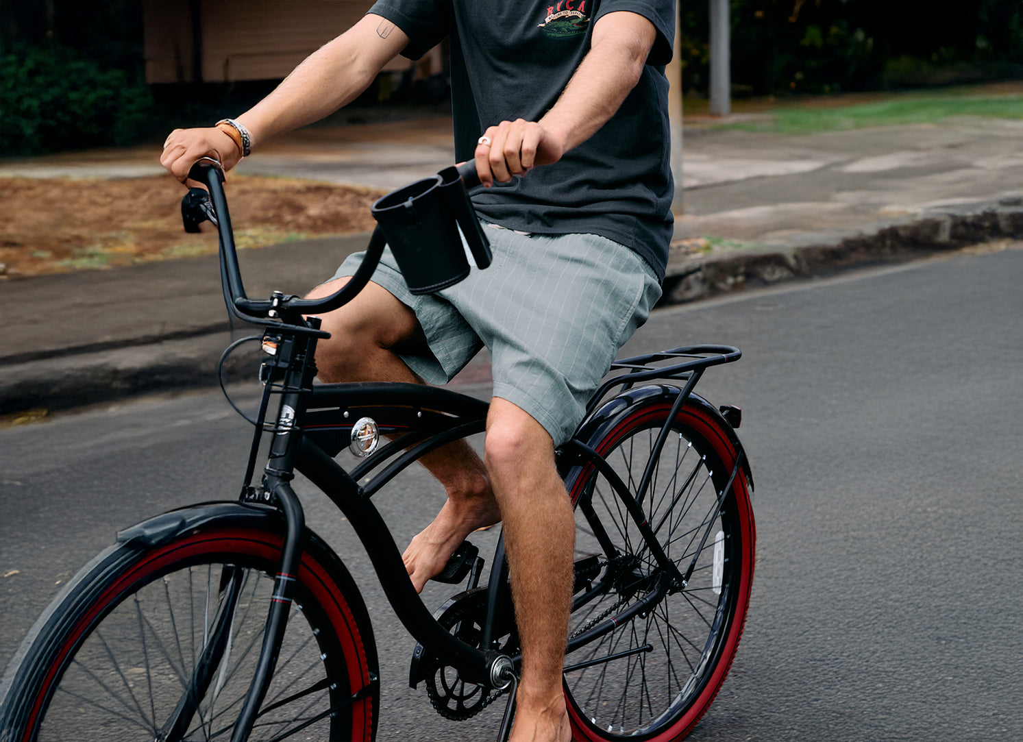 Person riding a bicycle on a road with a casual setting