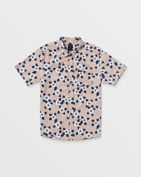 The Botanical Short Sleeve Shirt features a light pink base with a striking navy blue and white floral pattern, shown laid flat on a white background.